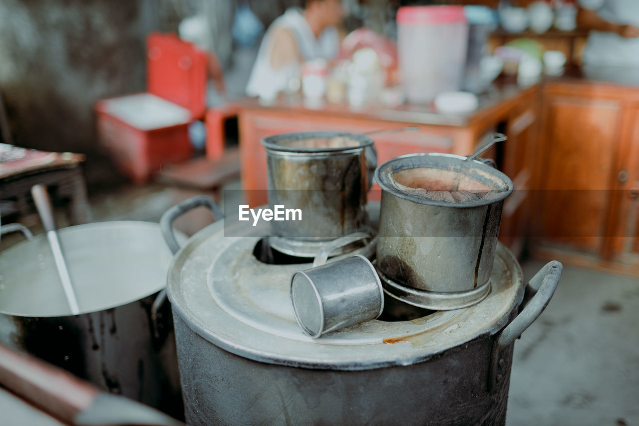 CLOSE-UP OF COFFEE CUP ON TABLE AT HOME