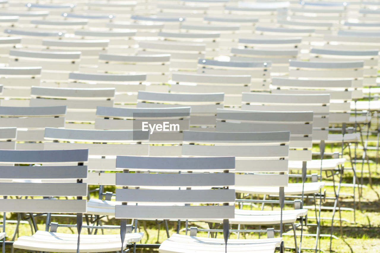 HIGH ANGLE VIEW OF DECK CHAIRS IN ROW