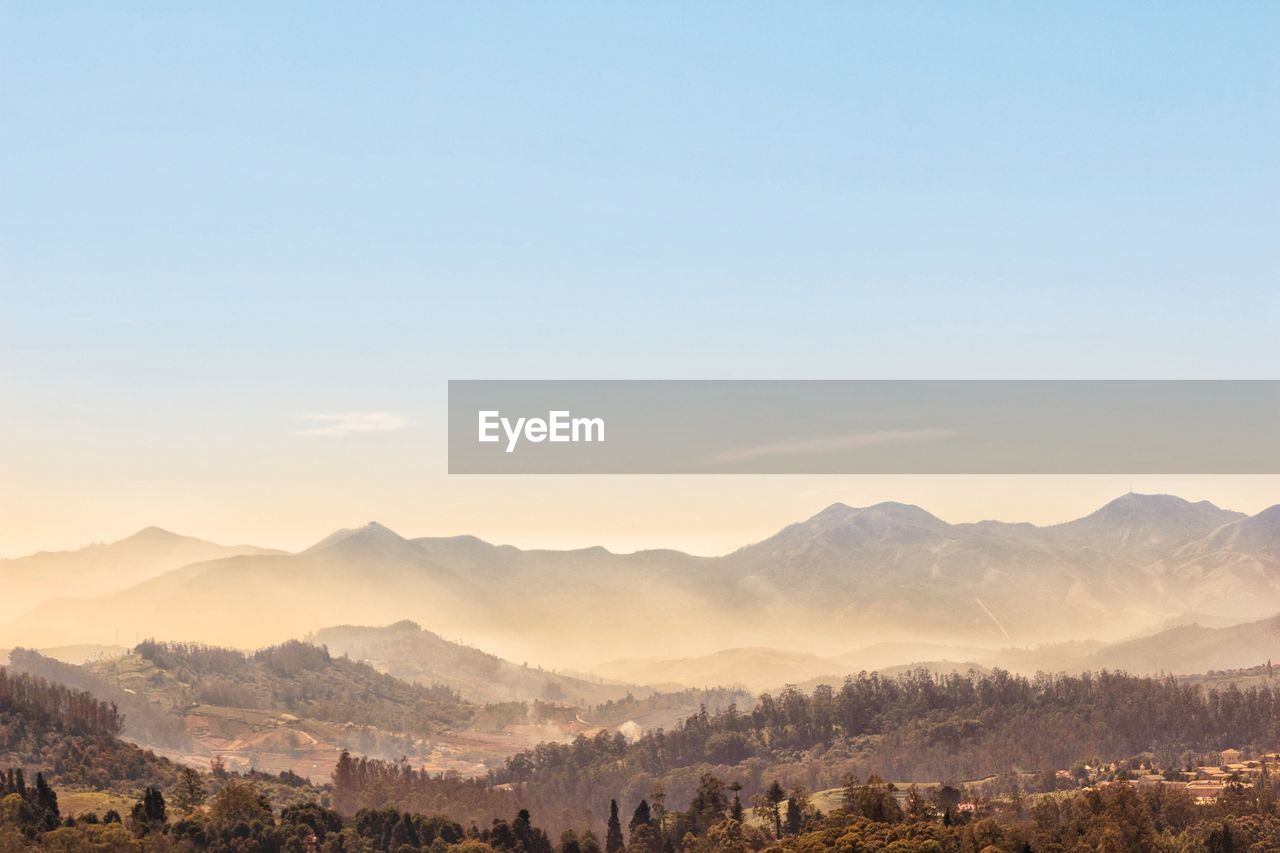Scenic view of mountains against sky during sunset