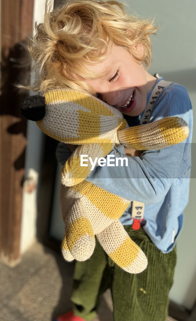 Portrait of a boy with his stuffed animal