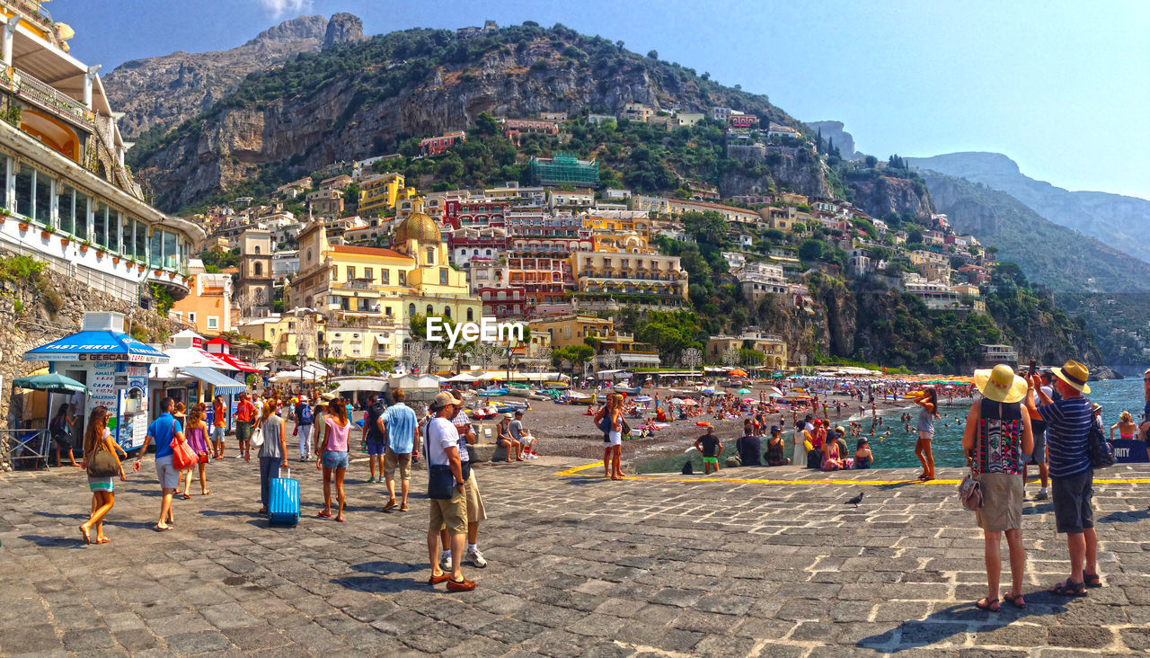 Crowds on walkway and beach at positano