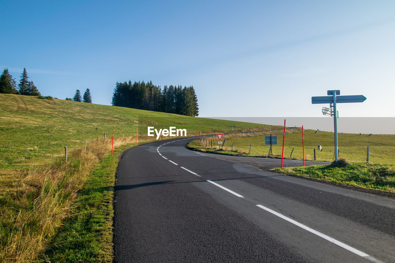 Country road against clear sky