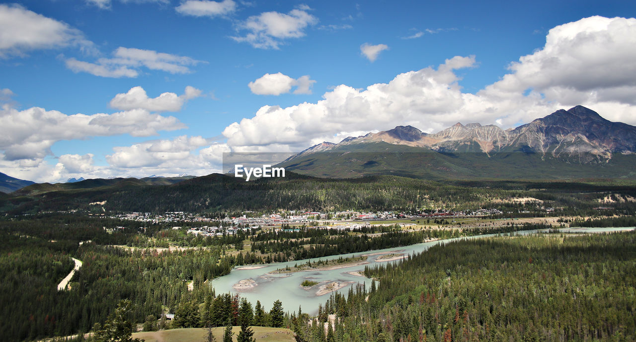 Scenic view of mountains against cloudy sky