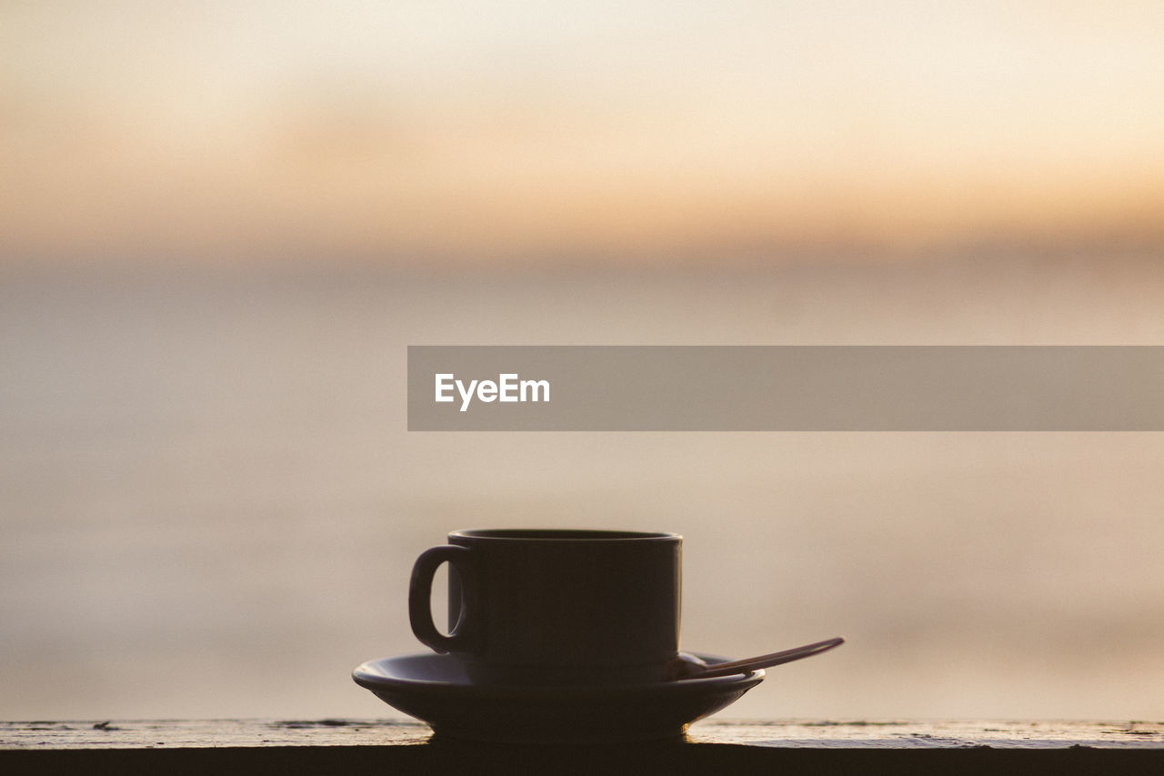 Close-up of coffee on table against sky