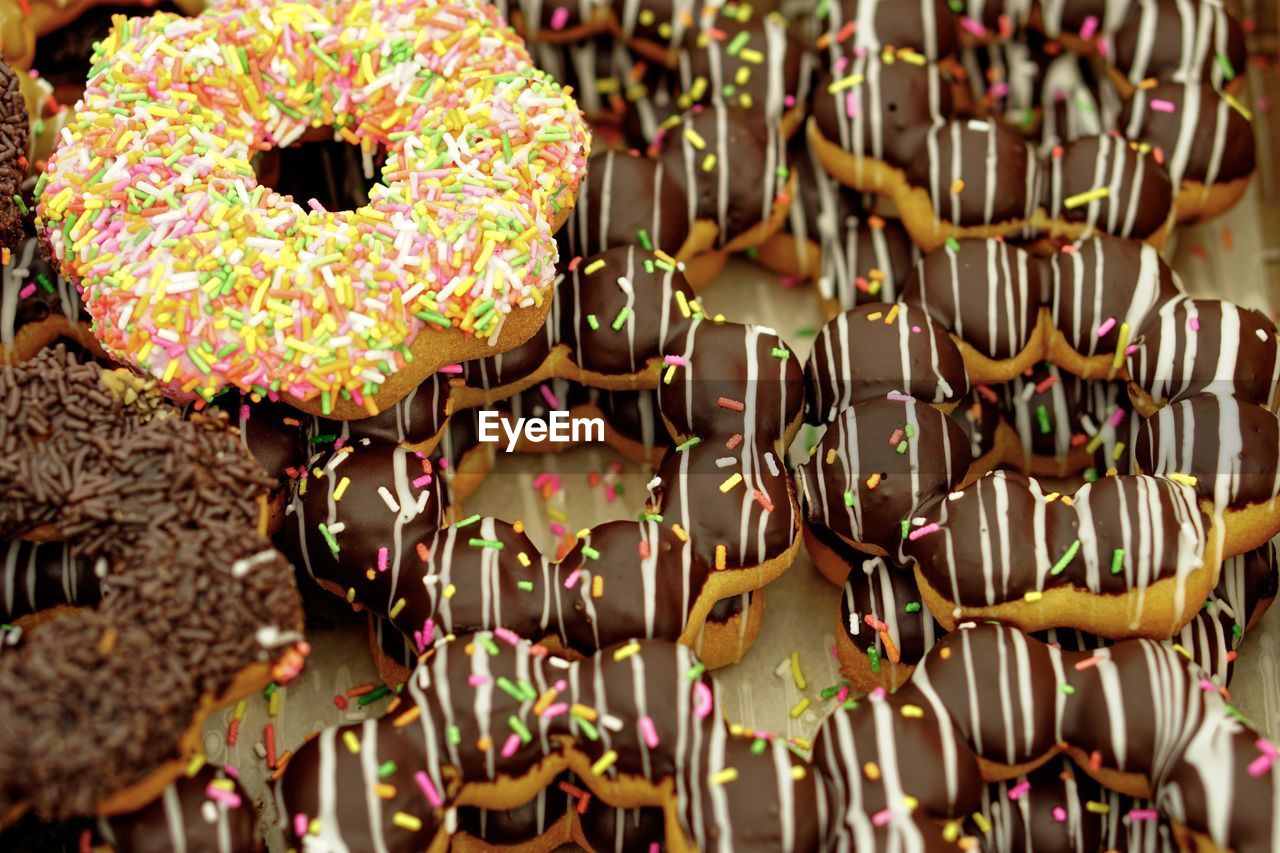 Close-up of multi colored donut for sale