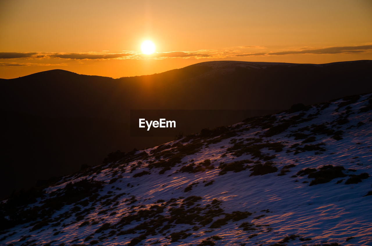 Scenic view of mountains during sunset