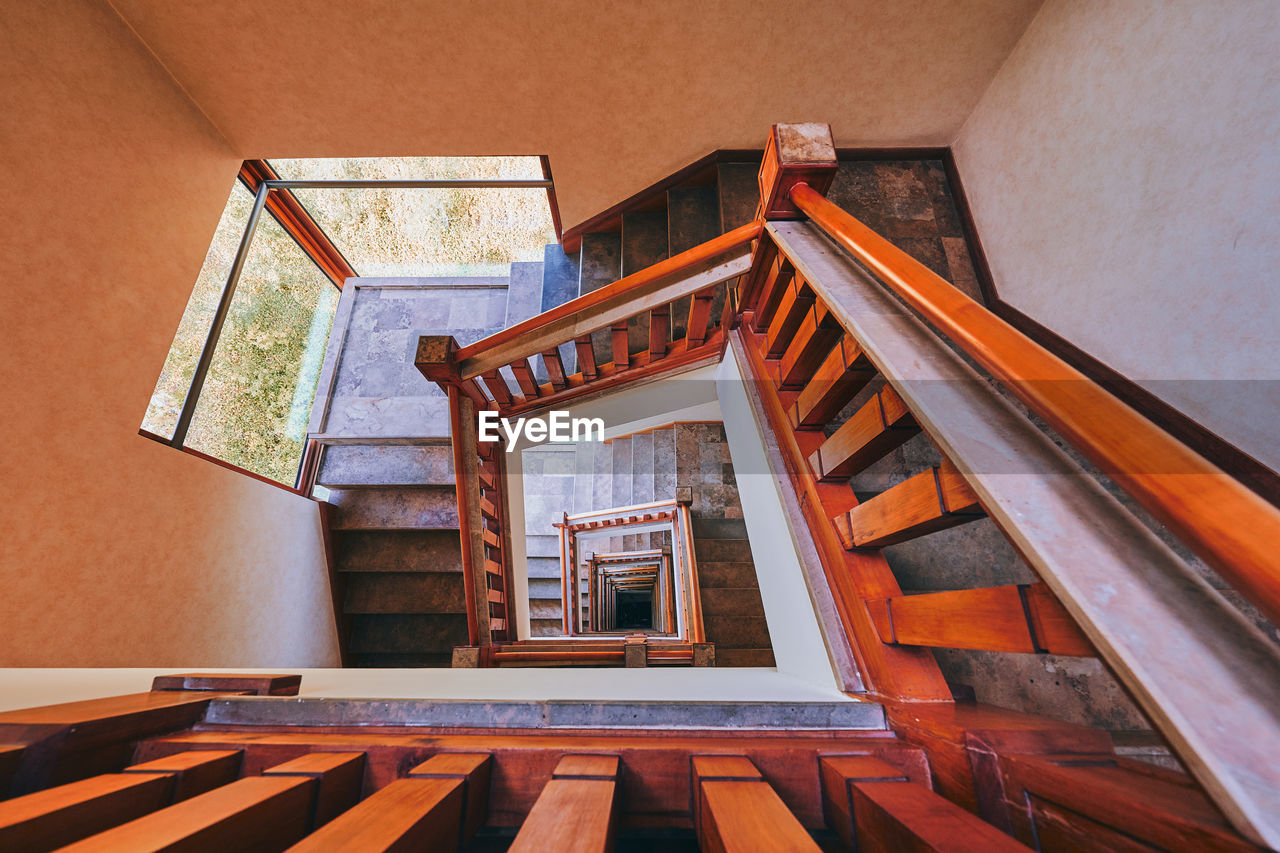 Directly below shot of spiral staircase of building