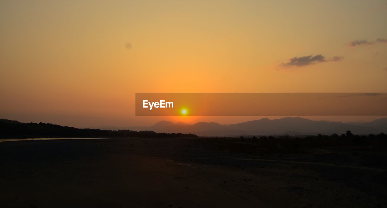 Scenic view of landscape at sunset