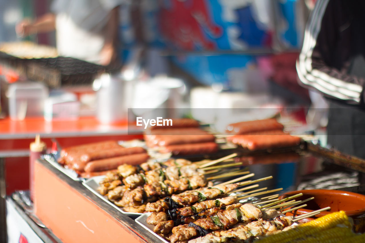 Close-up side view of kebabs on display