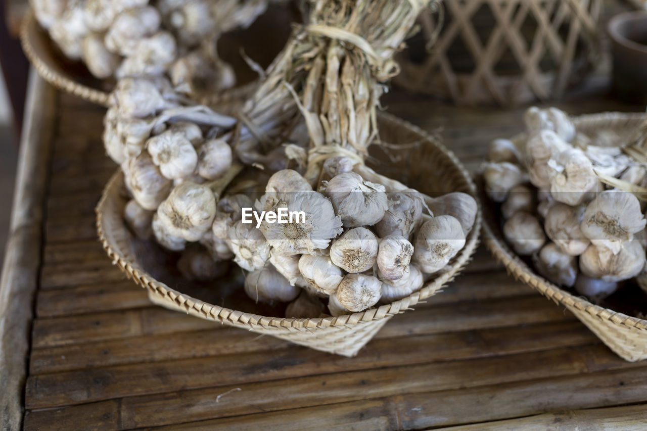 Selective focus large bunch of garlic in the saplings of agricultural gardeners in thailand, 