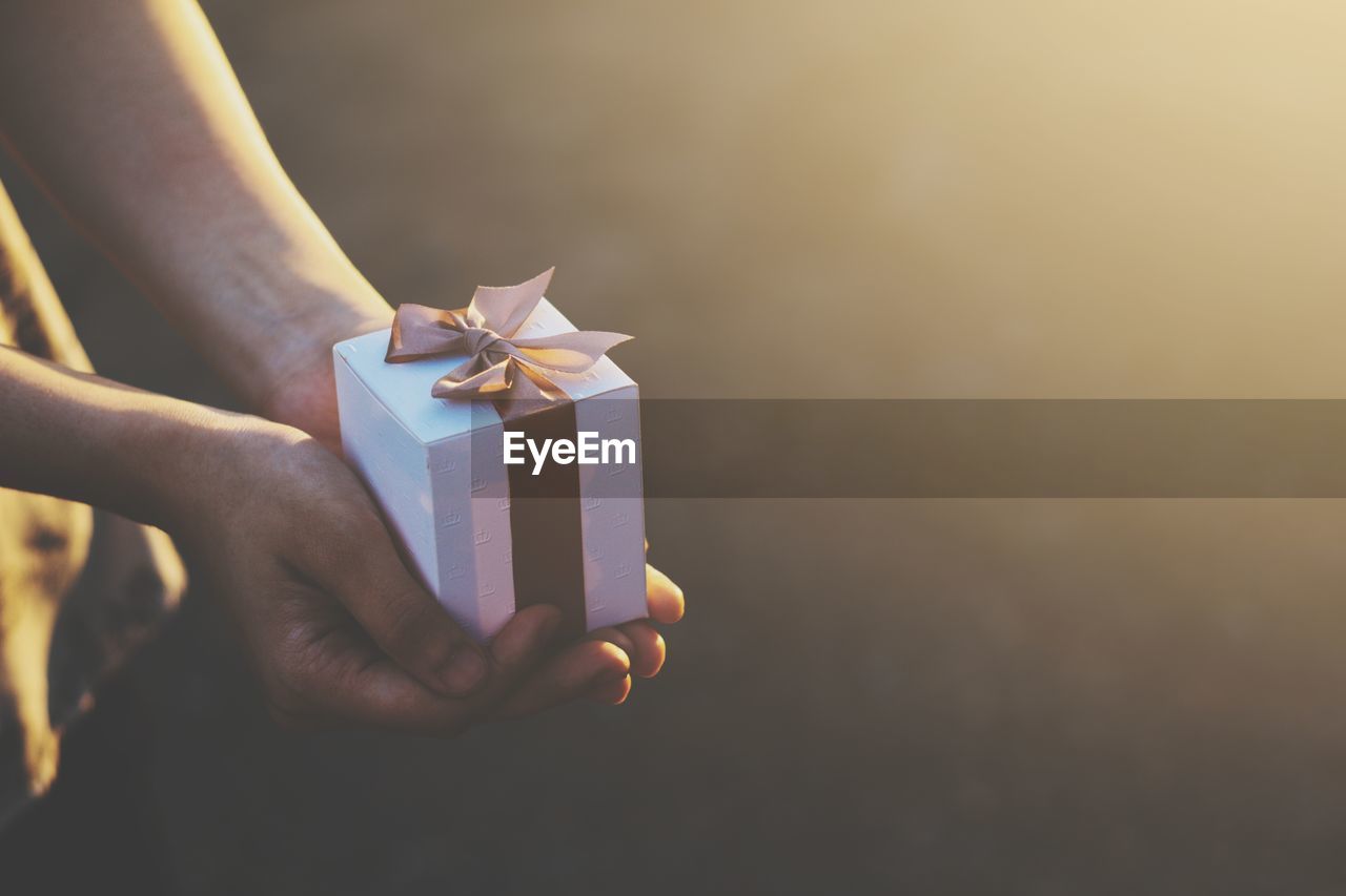 Close-up of woman holding gift box