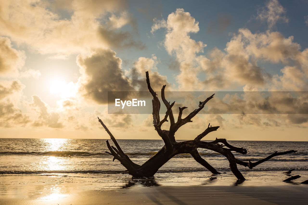 Scenic view of sea against sky at sunset