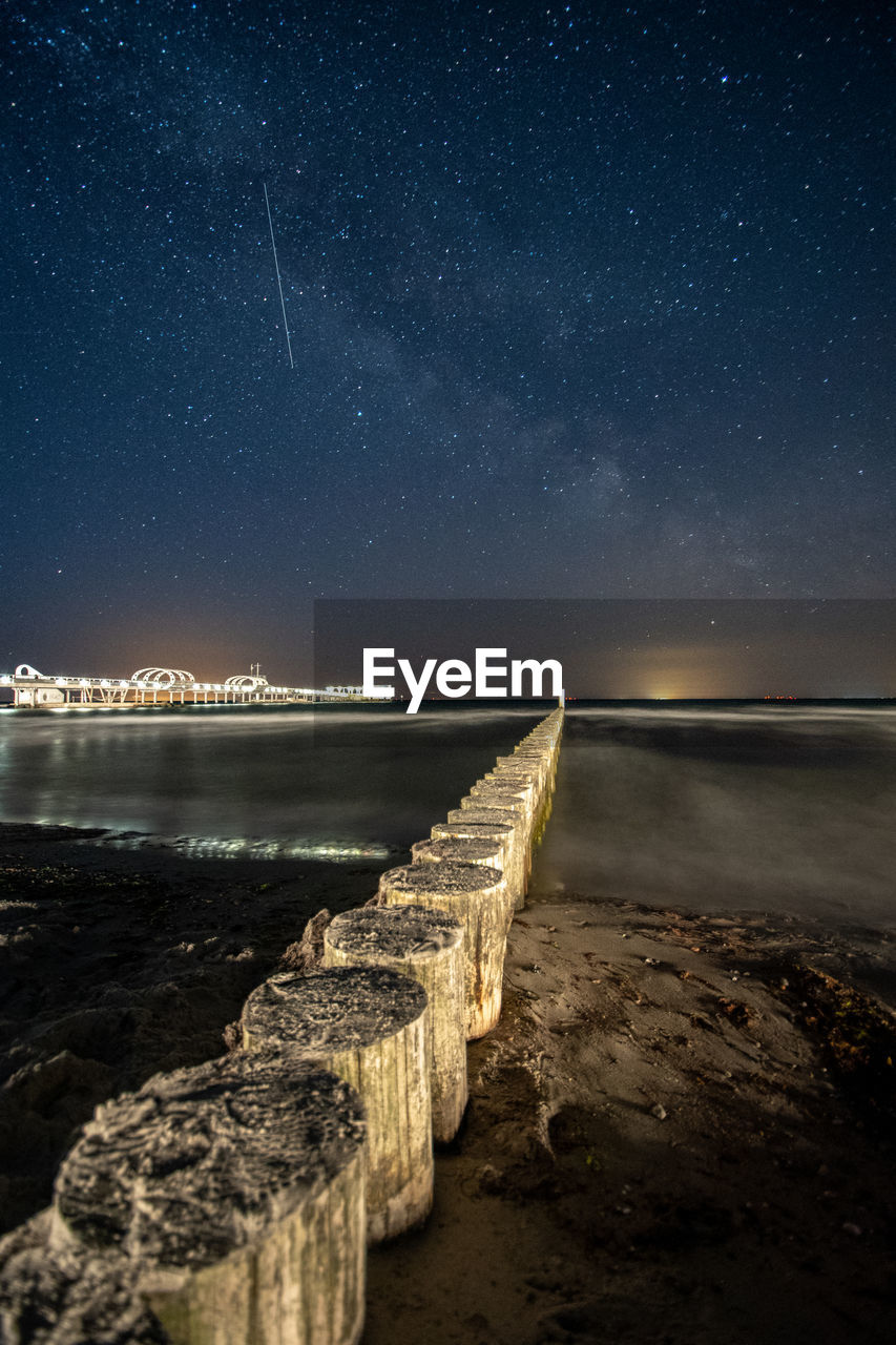 Scenic view of sea against sky at night