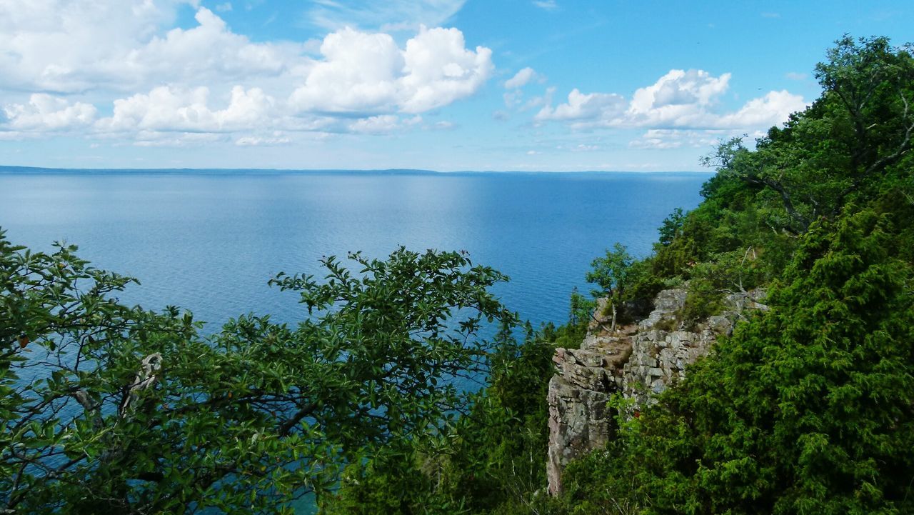 Scenic view of sea against cloudy sky