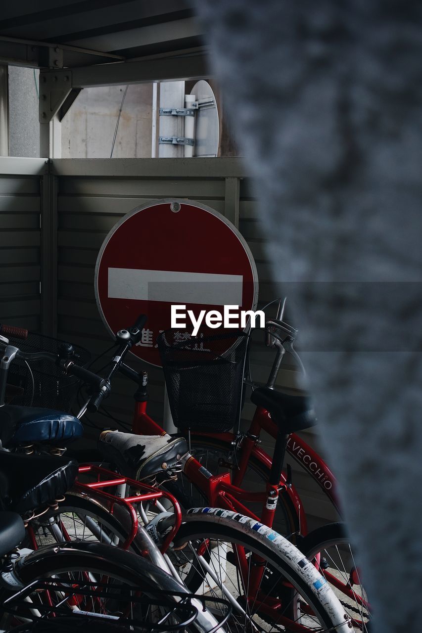 CLOSE-UP OF BICYCLE PARKED BY STREET