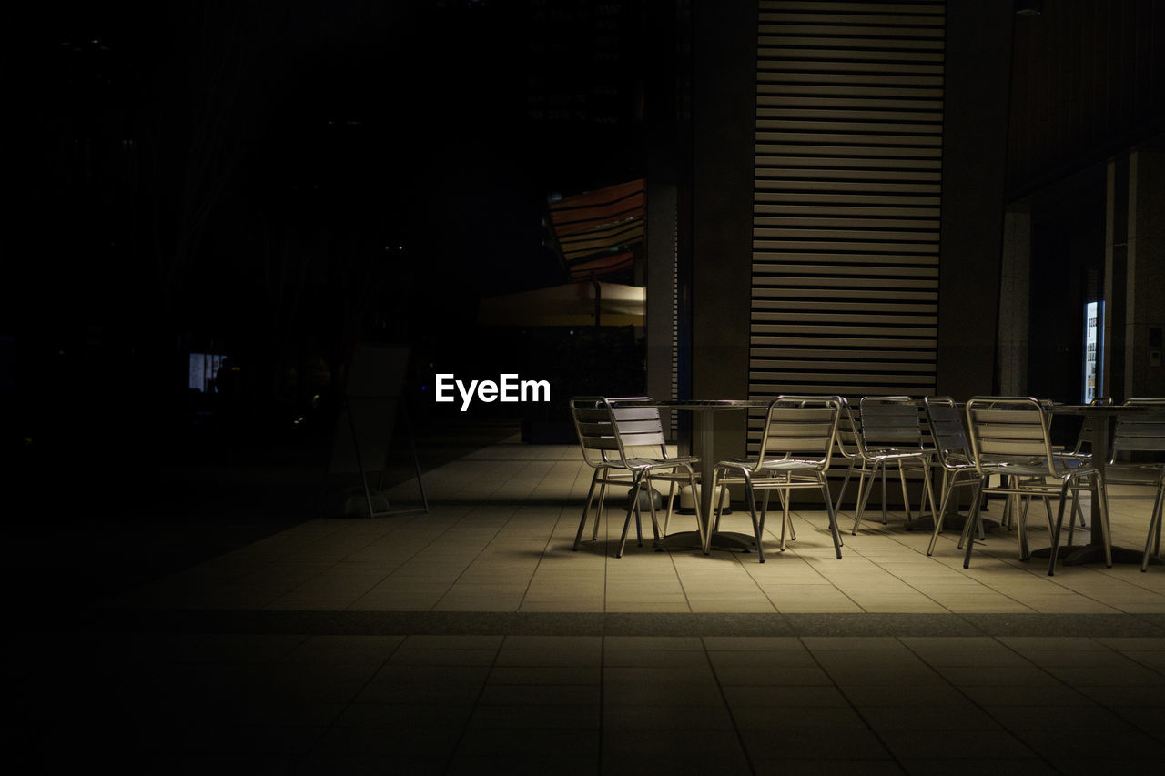 Empty chairs and table outside