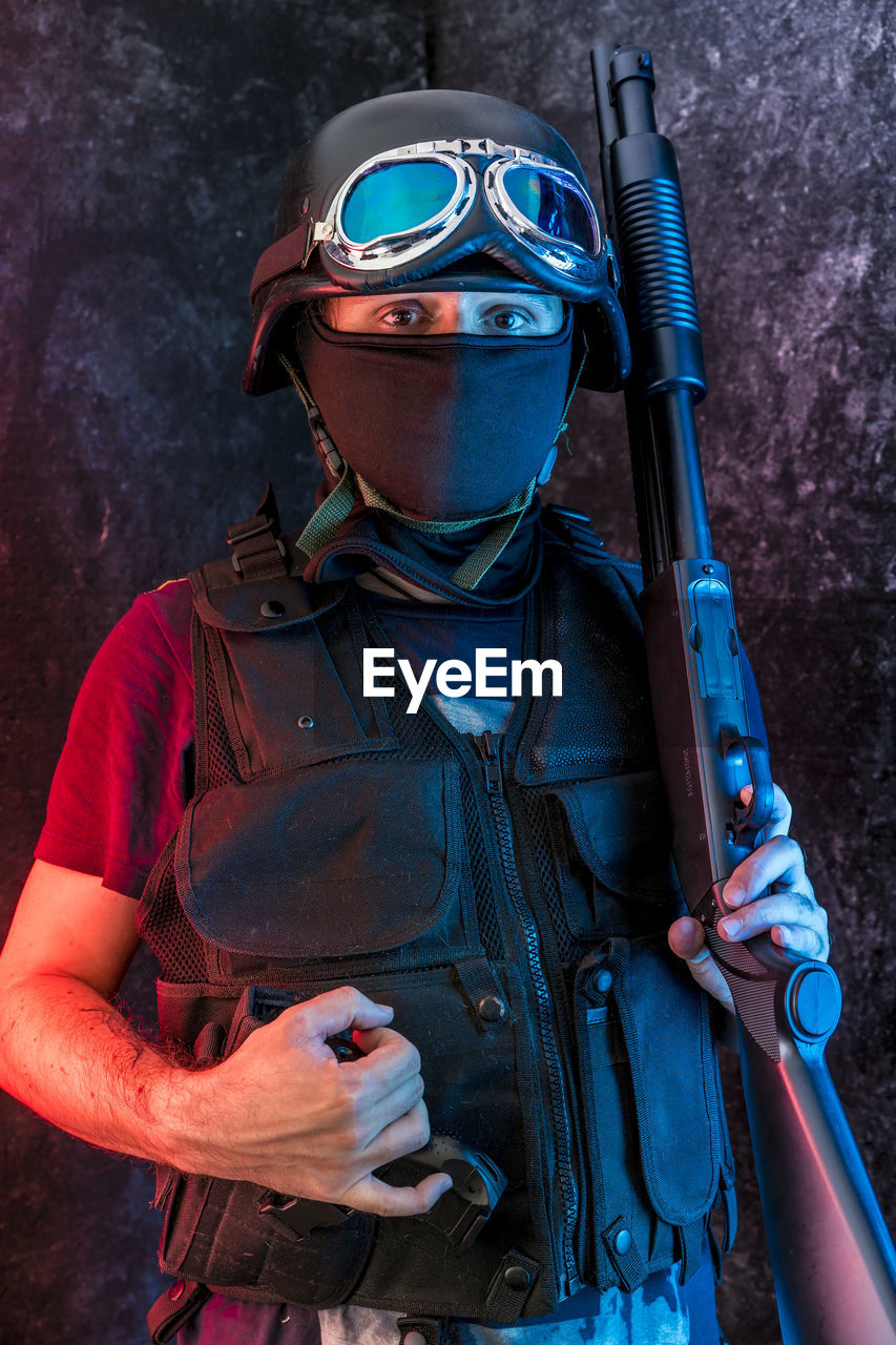 Counterterrorist with obscured face holding ak-47