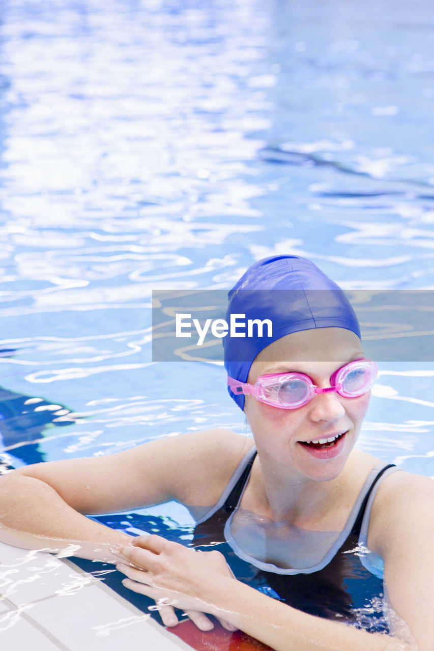 Woman at indoor swimming pool