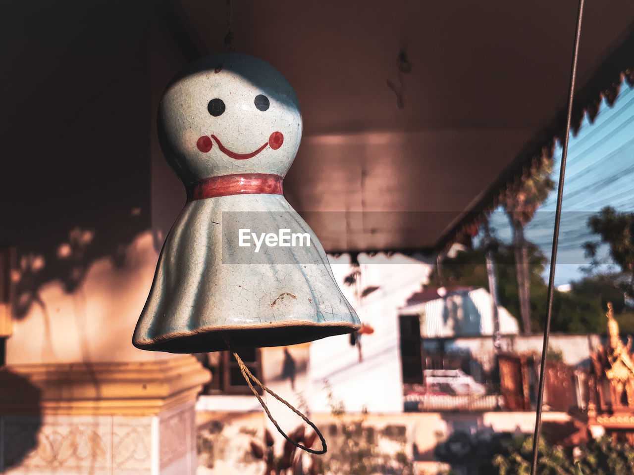 Close-up of ghost toy hanging outside house