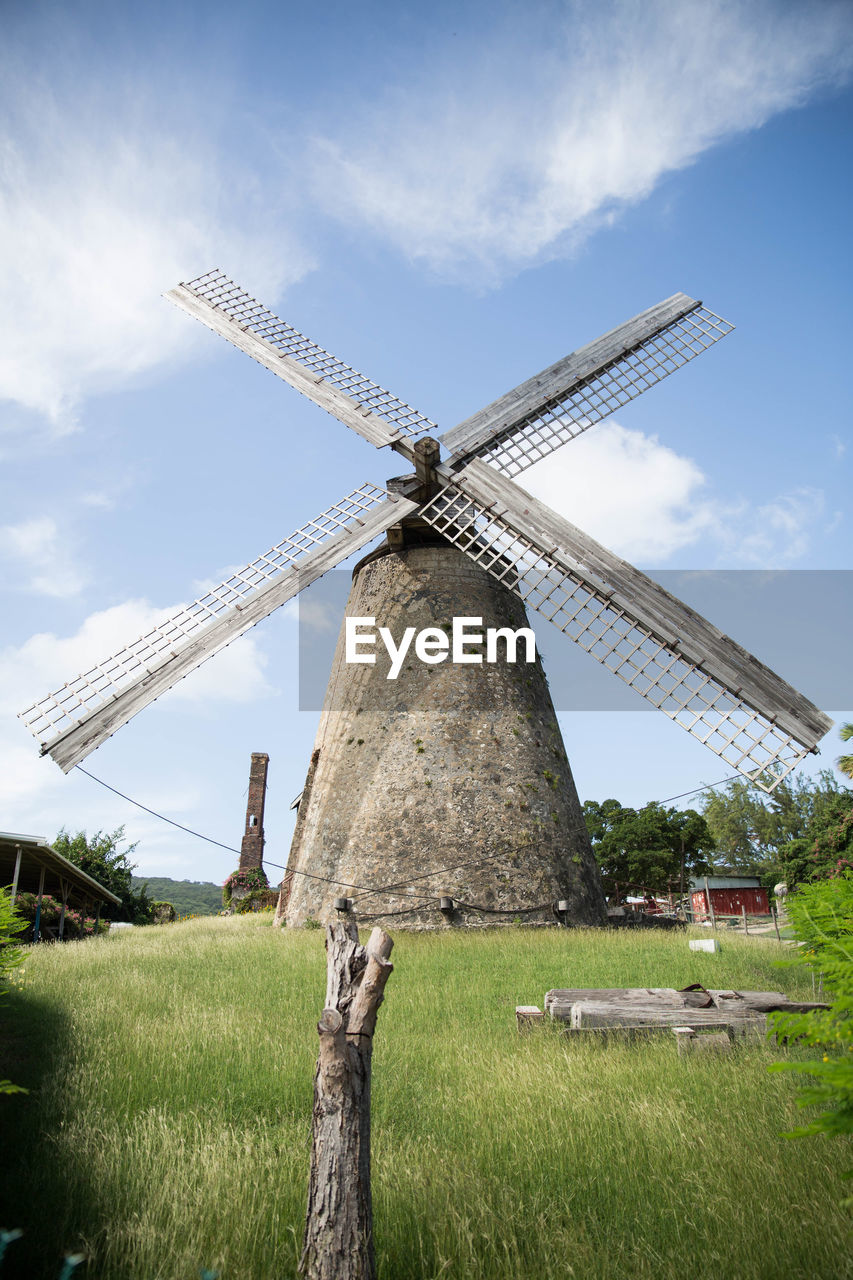 Traditional windmill against sky