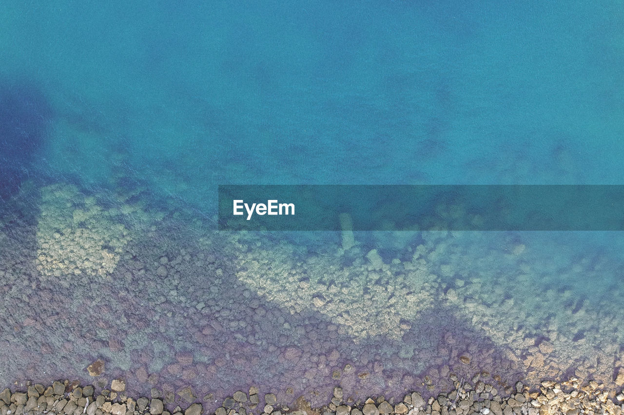 HIGH ANGLE VIEW OF SEA AND CORAL