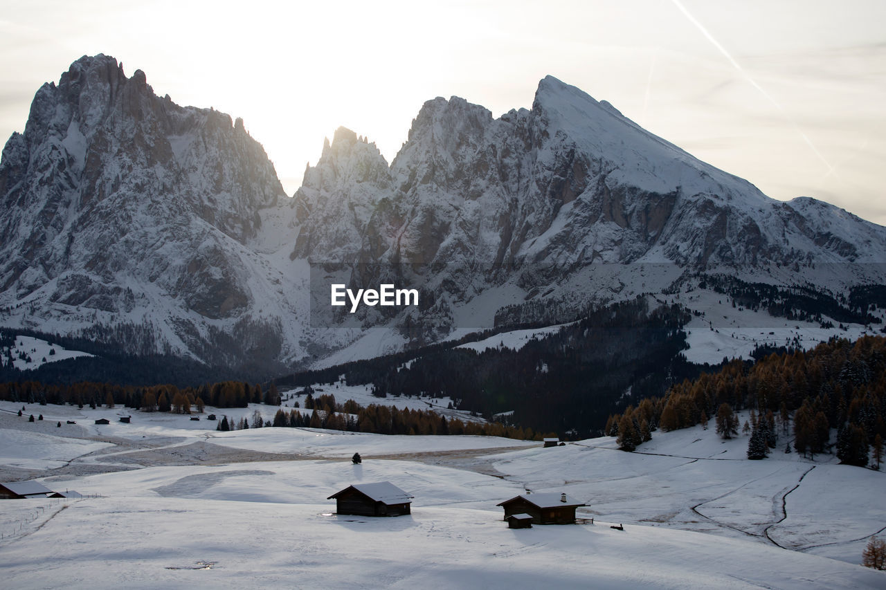 Scenic view of snow covered mountains against sky