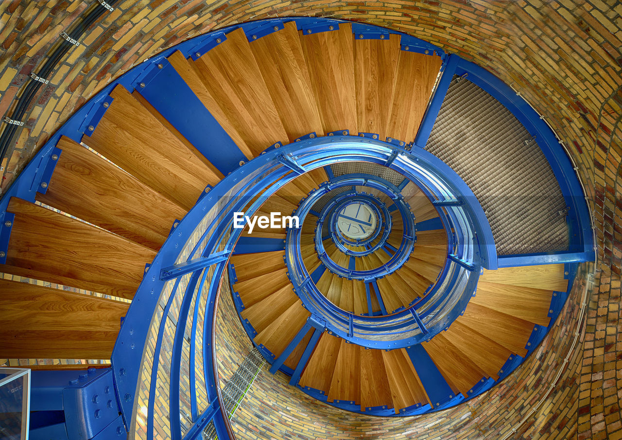 CLOSE-UP OF SPIRAL STAIRS