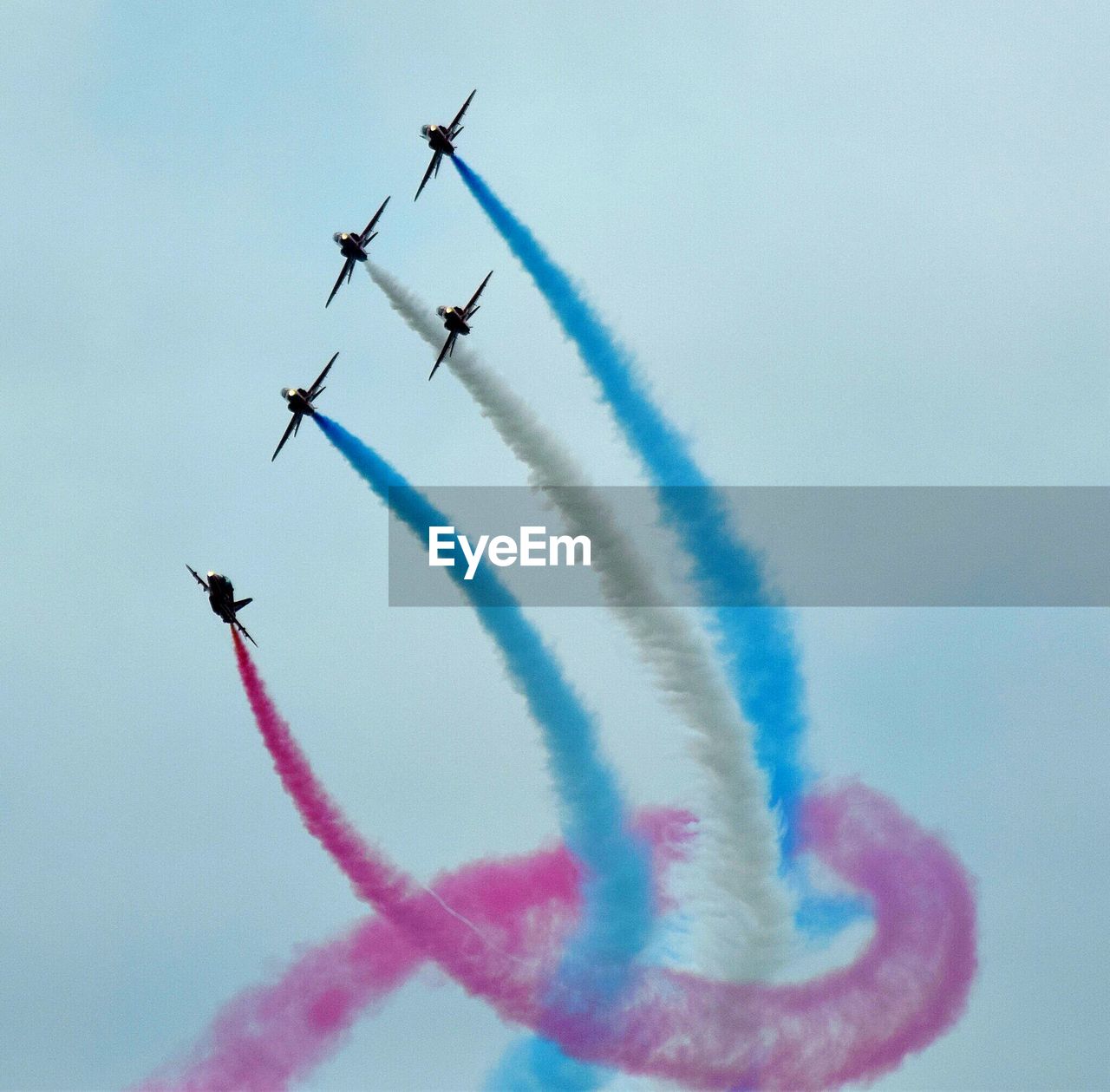 Low angle view of airshow against sky