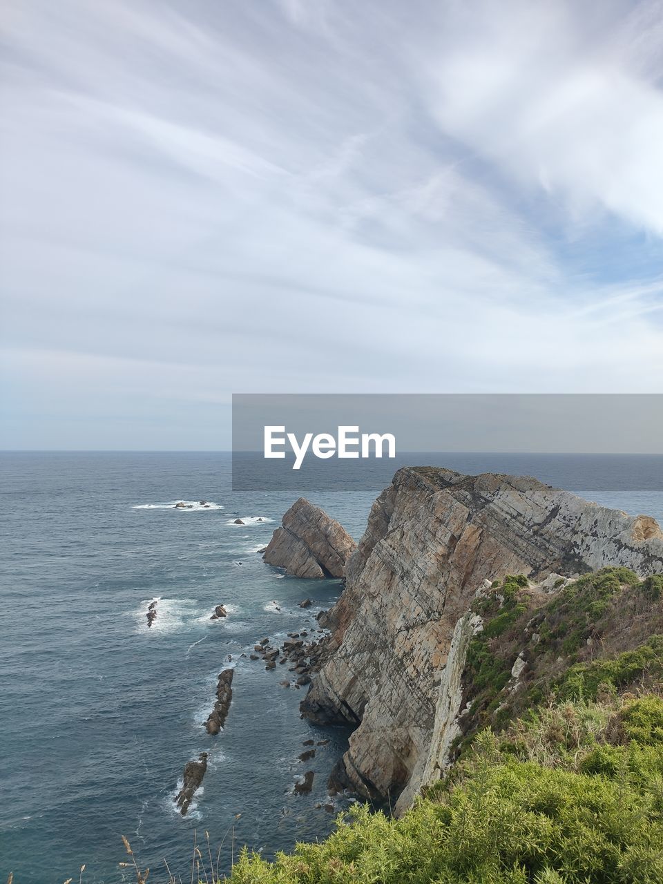 water, nature, terrain, day, scenics - nature, no people, beauty in nature, cliff, land, sea, plant, reflection, mountain, outdoors, tranquility, tree, blue, sky, rock, cloud, tranquil scene, beach, high angle view, environment, motion, non-urban scene, sunlight