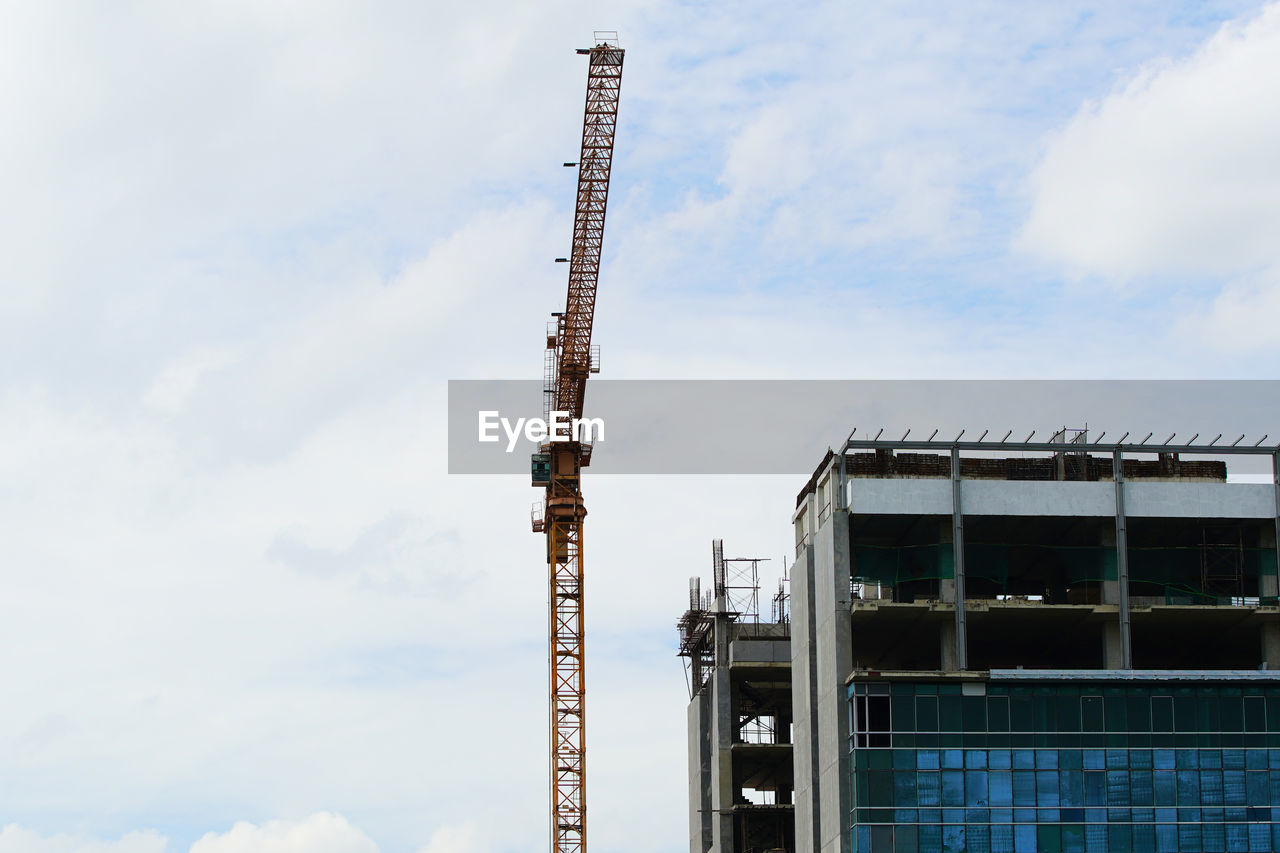 low angle view of construction site against sky