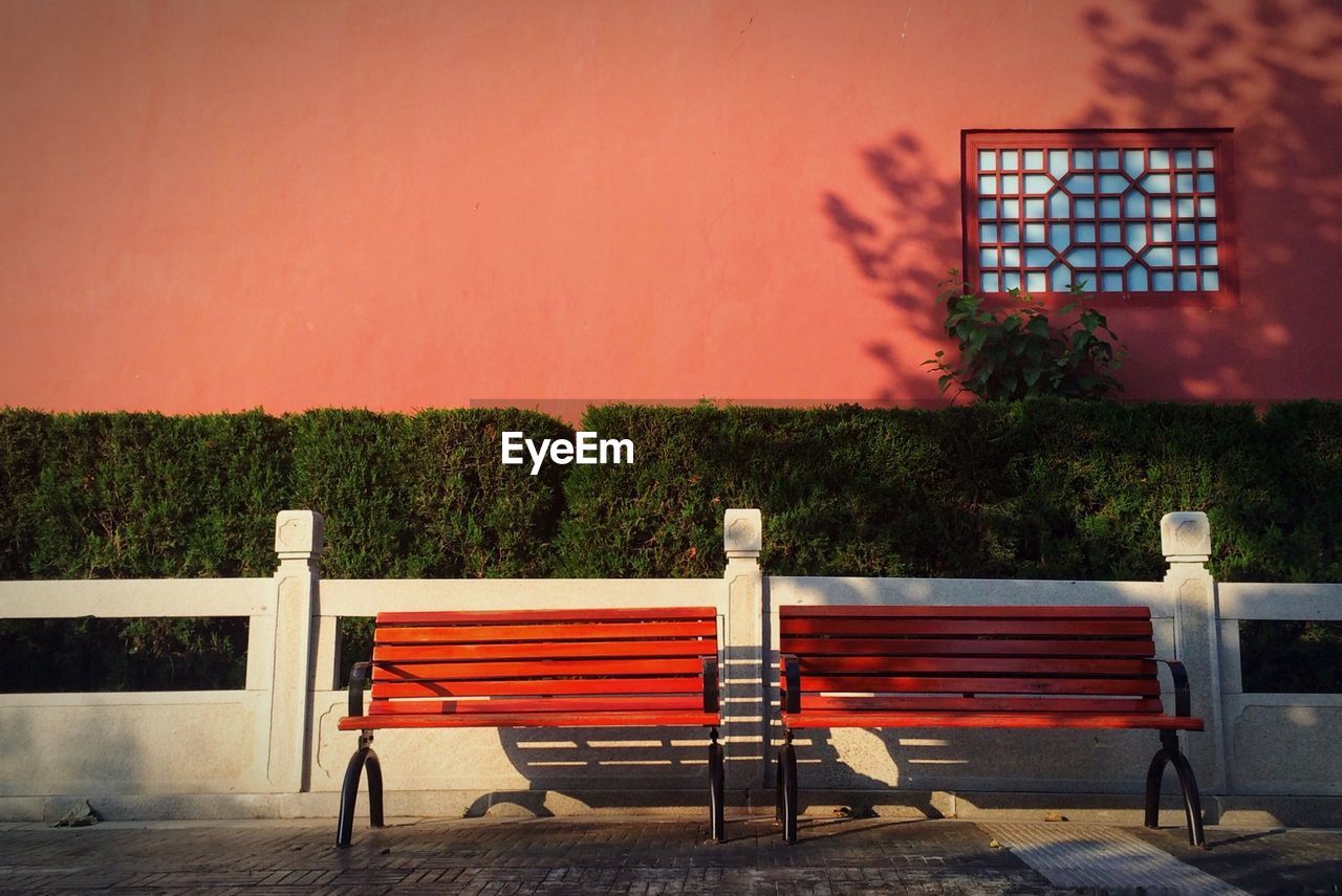 Empty benches on footpath