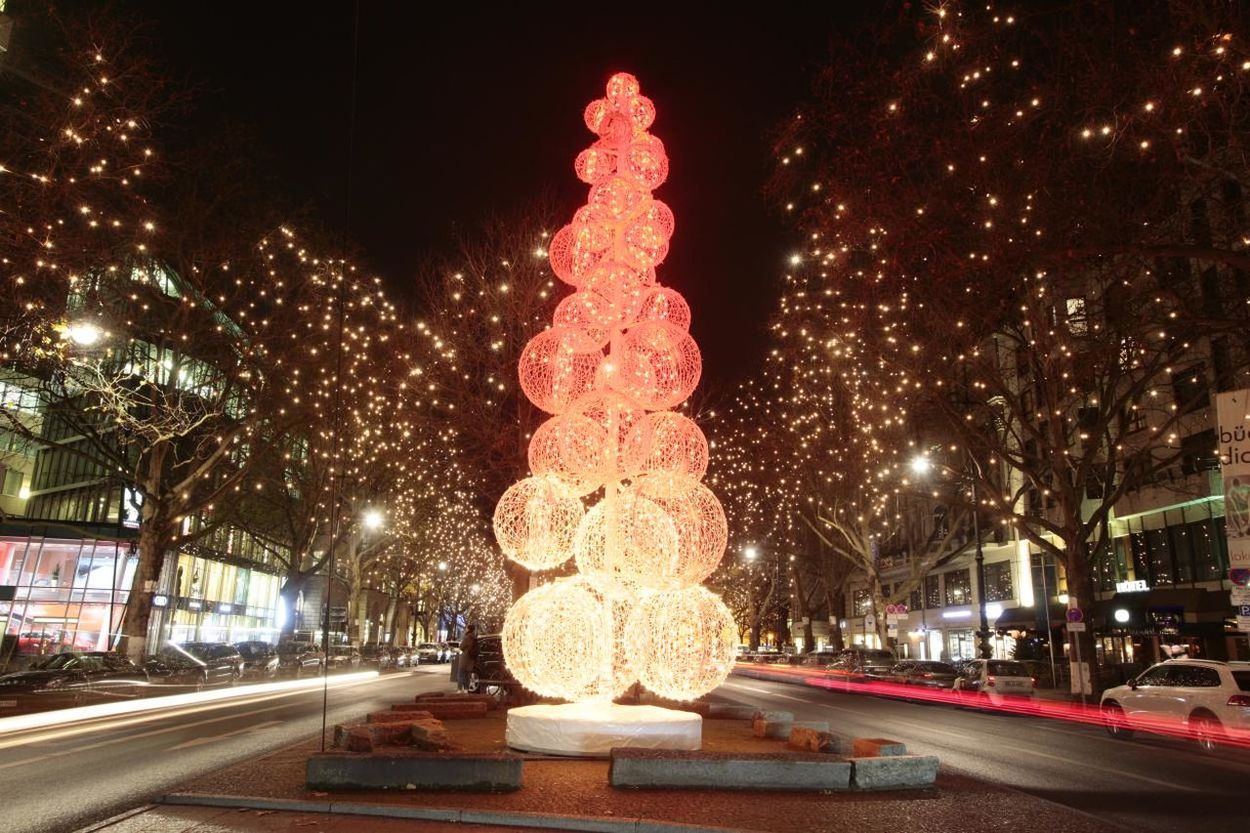 VIEW OF ILLUMINATED STREET LIGHTS AT NIGHT