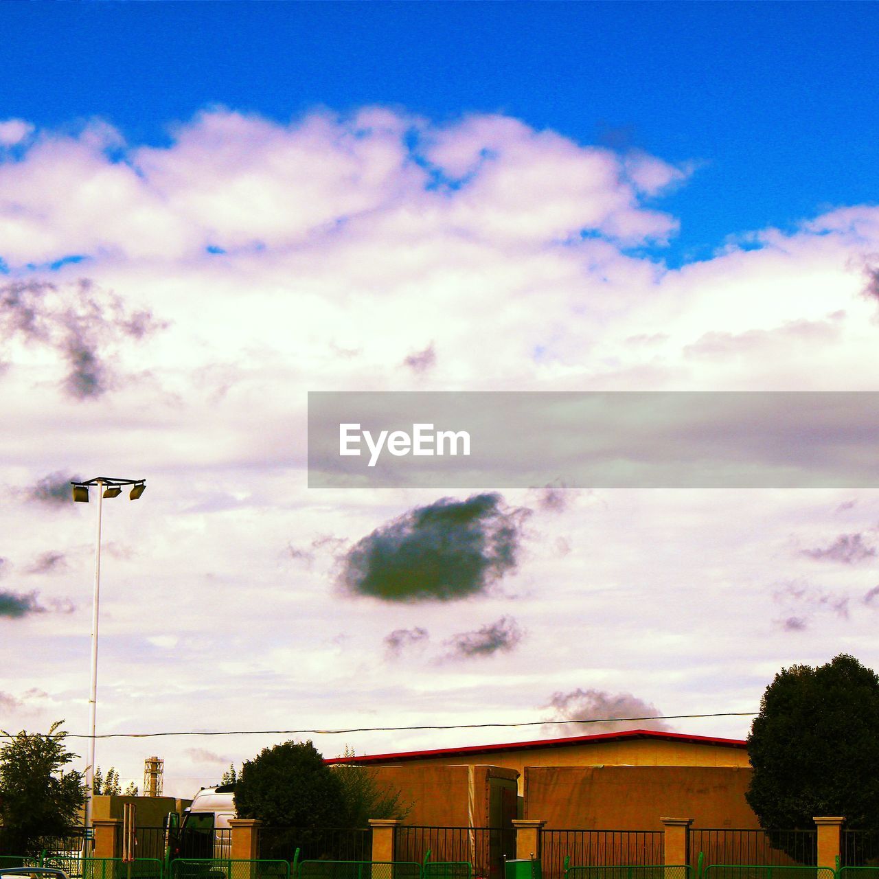 PANORAMIC VIEW OF TREES AGAINST SKY AND CLOUDS