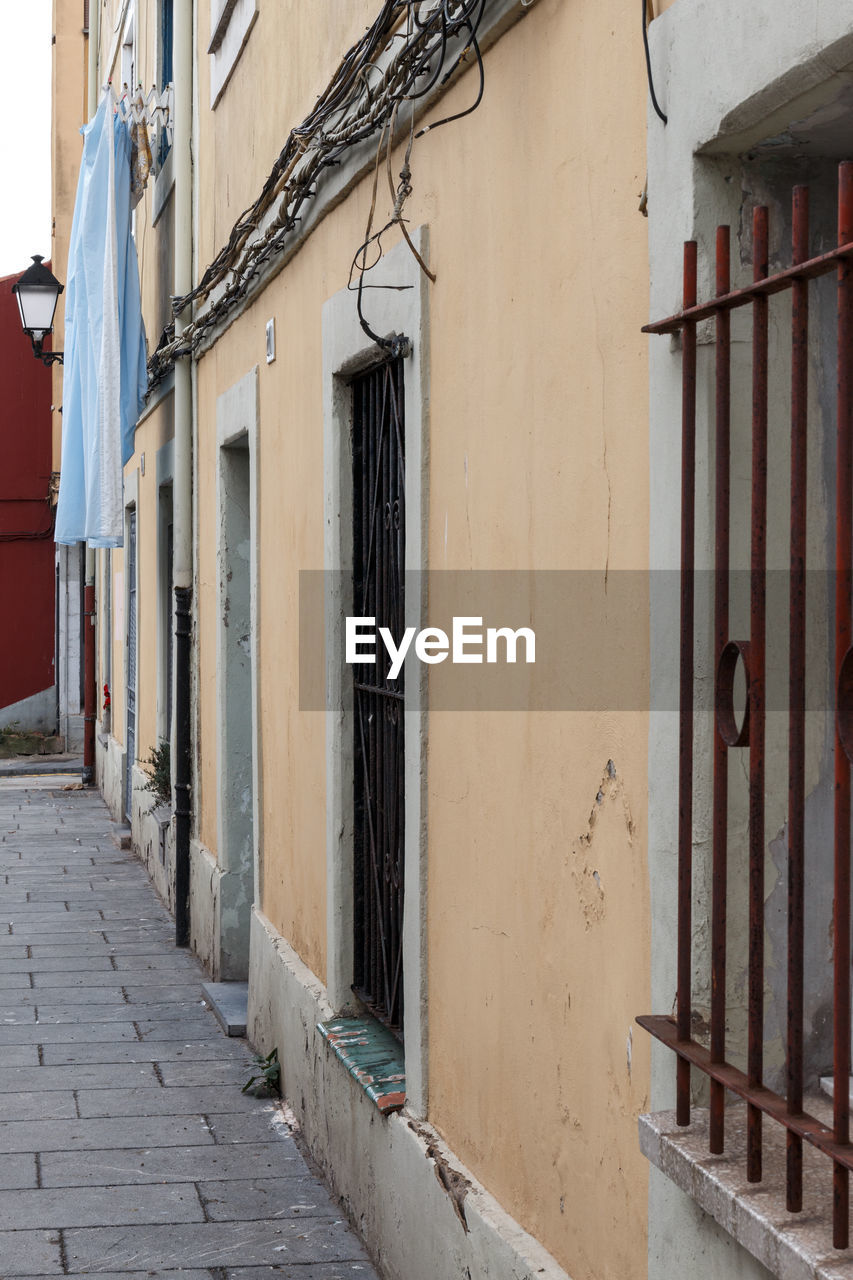 Alley amidst buildings in city