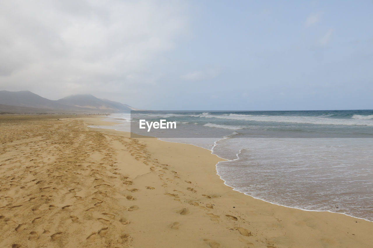 VIEW OF BEACH AGAINST SKY