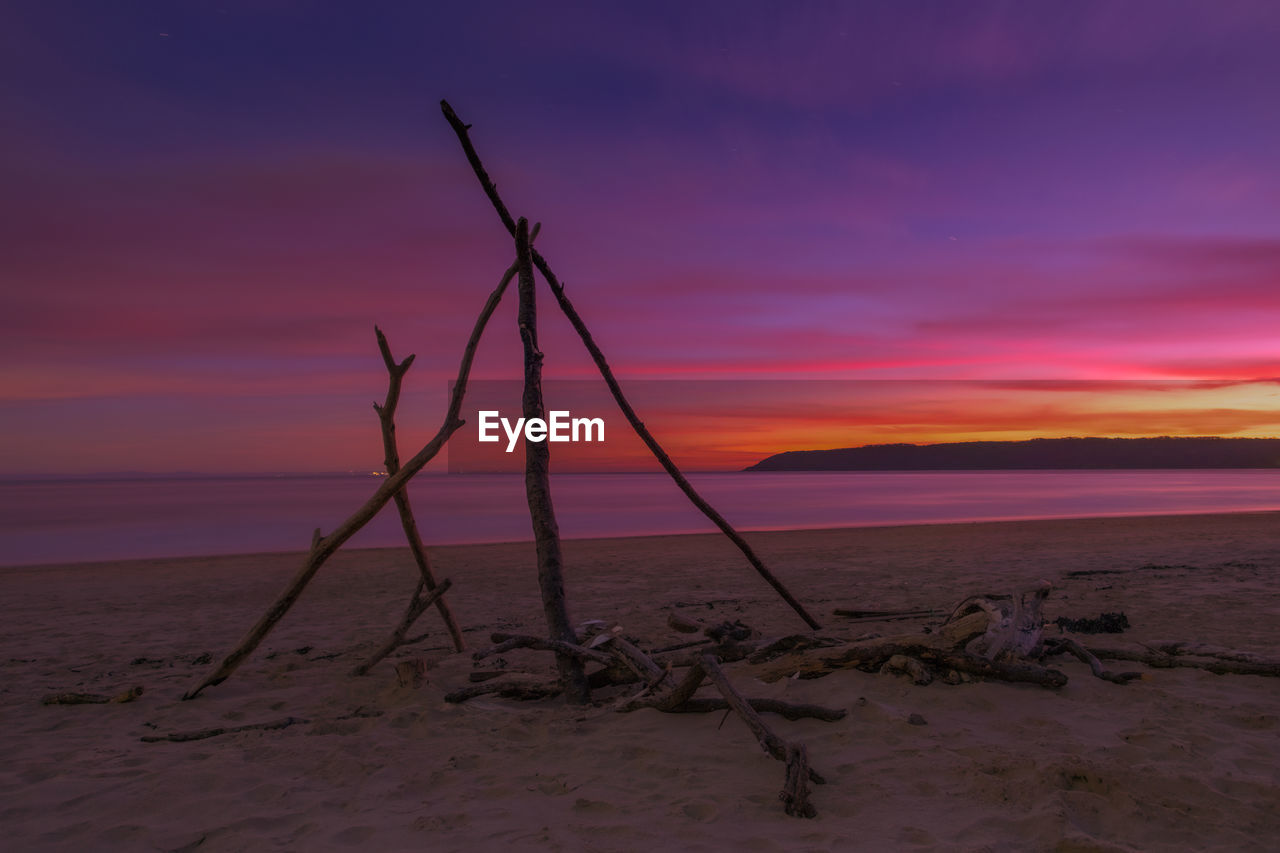 sky, land, sunset, scenics - nature, sea, beauty in nature, horizon, nature, water, beach, tranquility, ocean, sand, cloud, tranquil scene, environment, shore, no people, landscape, horizon over water, dawn, coast, evening, dramatic sky, wind, outdoors, idyllic, natural environment, orange color, pink, non-urban scene, wave