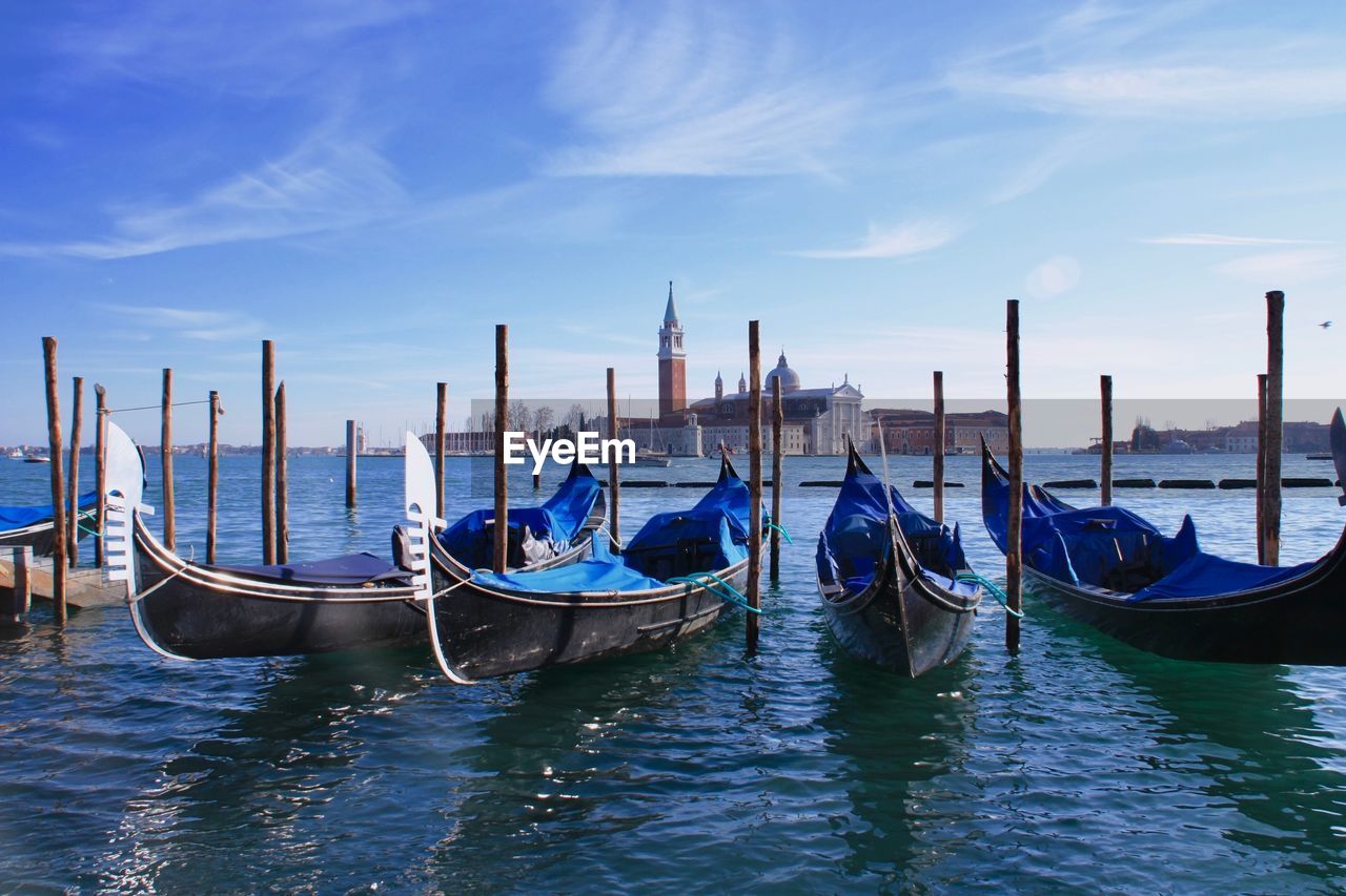 BOATS MOORED ON SEA