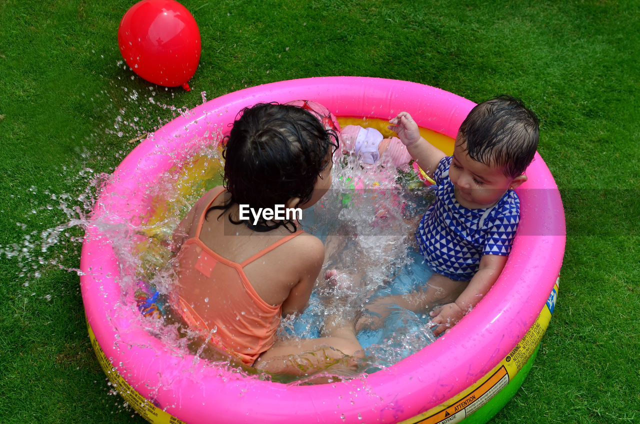 Children playing in swimming pool