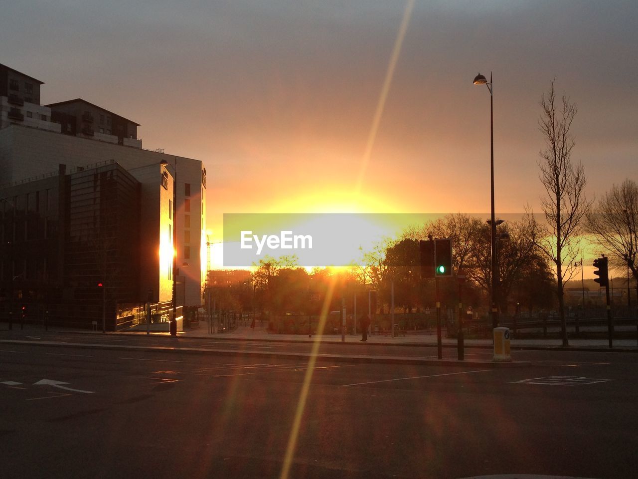 ROAD PASSING THROUGH CITY AT SUNSET