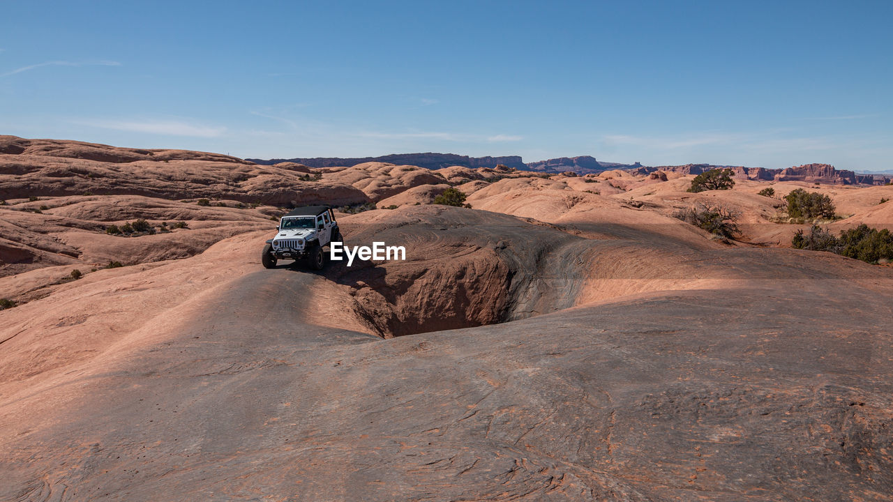 Full frame view of jeeps enjoying the rugged sandstone terrain