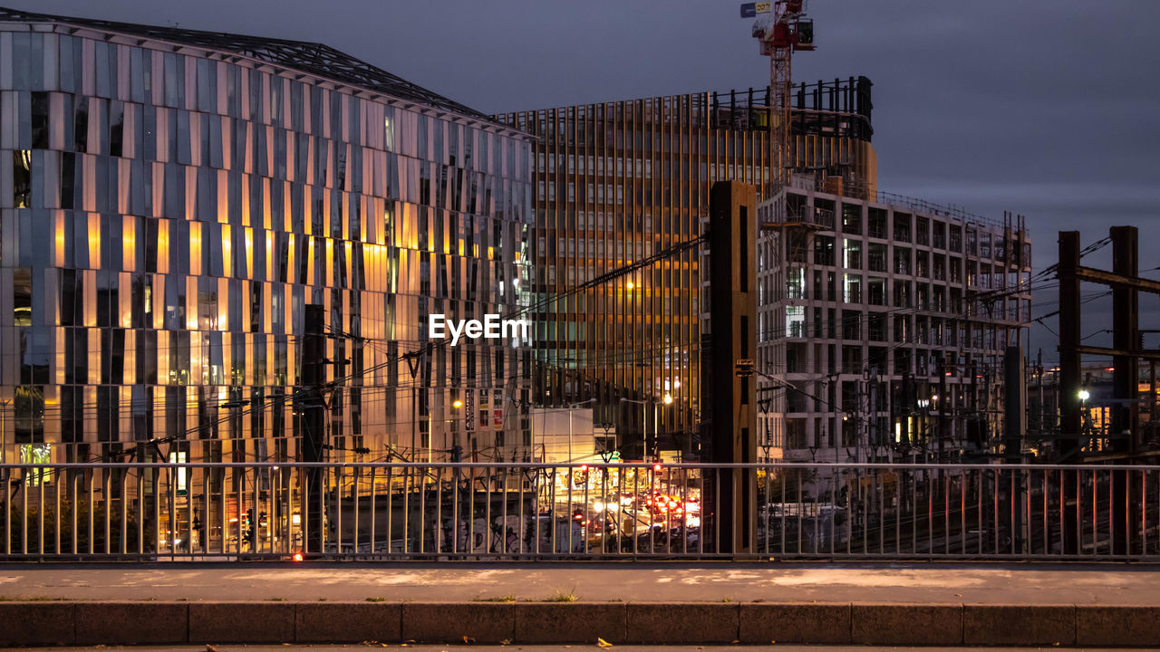 Urban scene with buildings, light, reflection and construction site.