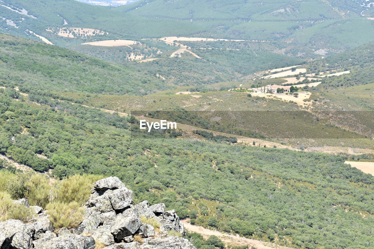 HIGH ANGLE VIEW OF VALLEY AND MOUNTAIN RANGE