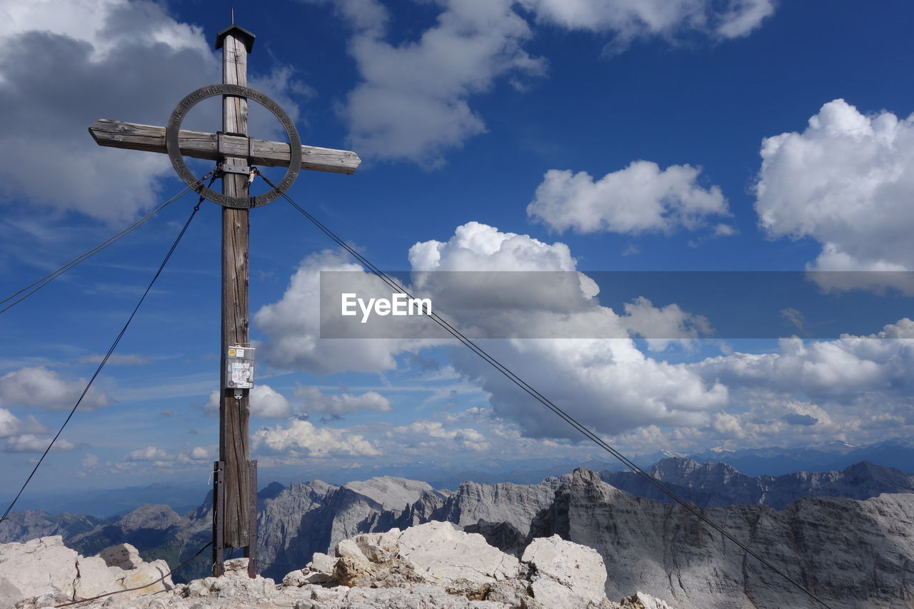 Low angle view of mountain against blue sky