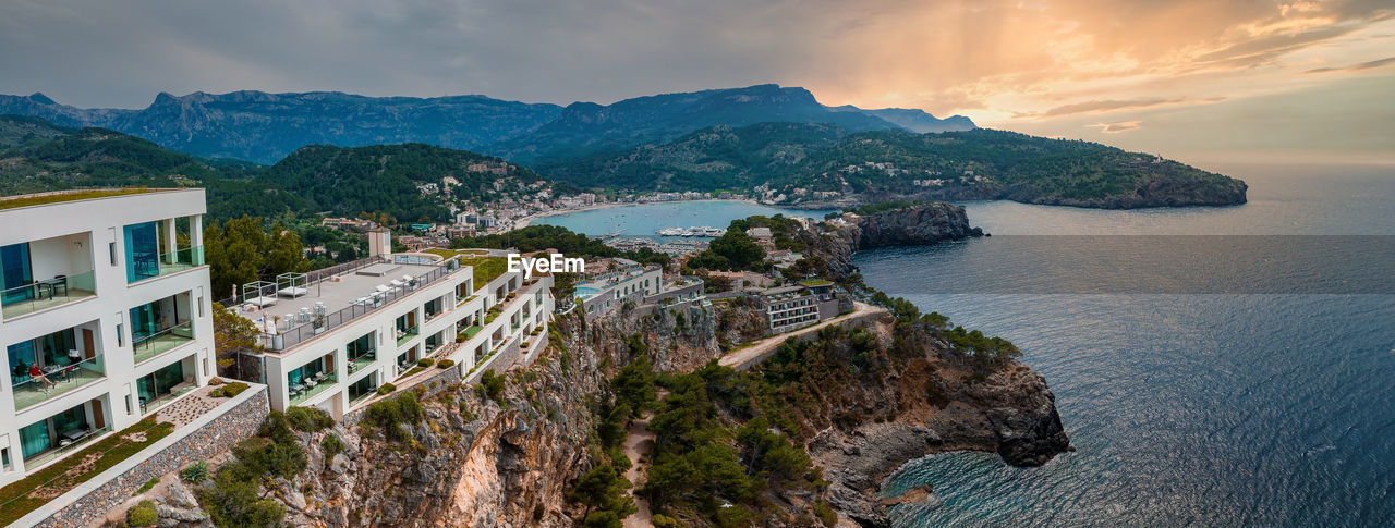 Aerial view of the luxury cliff house hotel on top of the cliff on the island of mallorca.