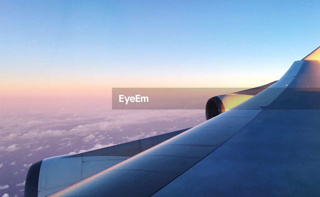 AIRPLANE WING AGAINST SKY