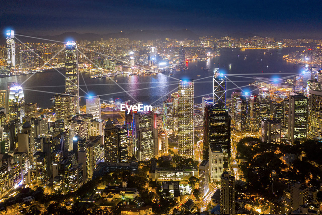 Aerial view of illuminated buildings in city at night