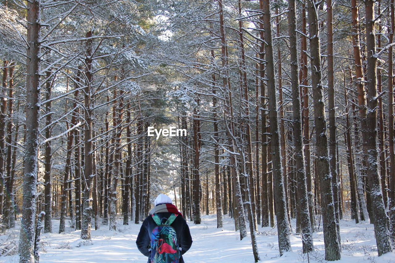 FULL LENGTH OF PERSON ON SNOW COVERED LAND