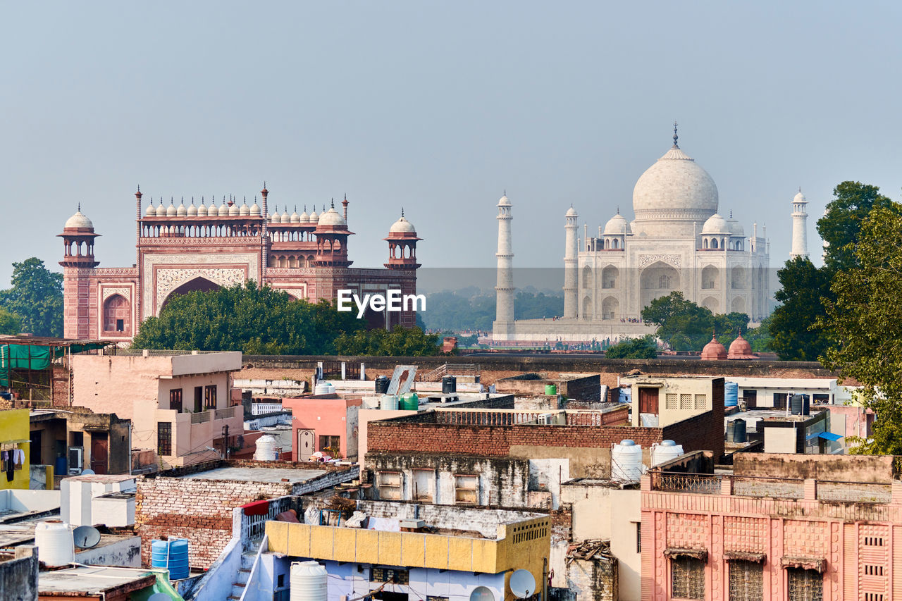 buildings in city against clear sky