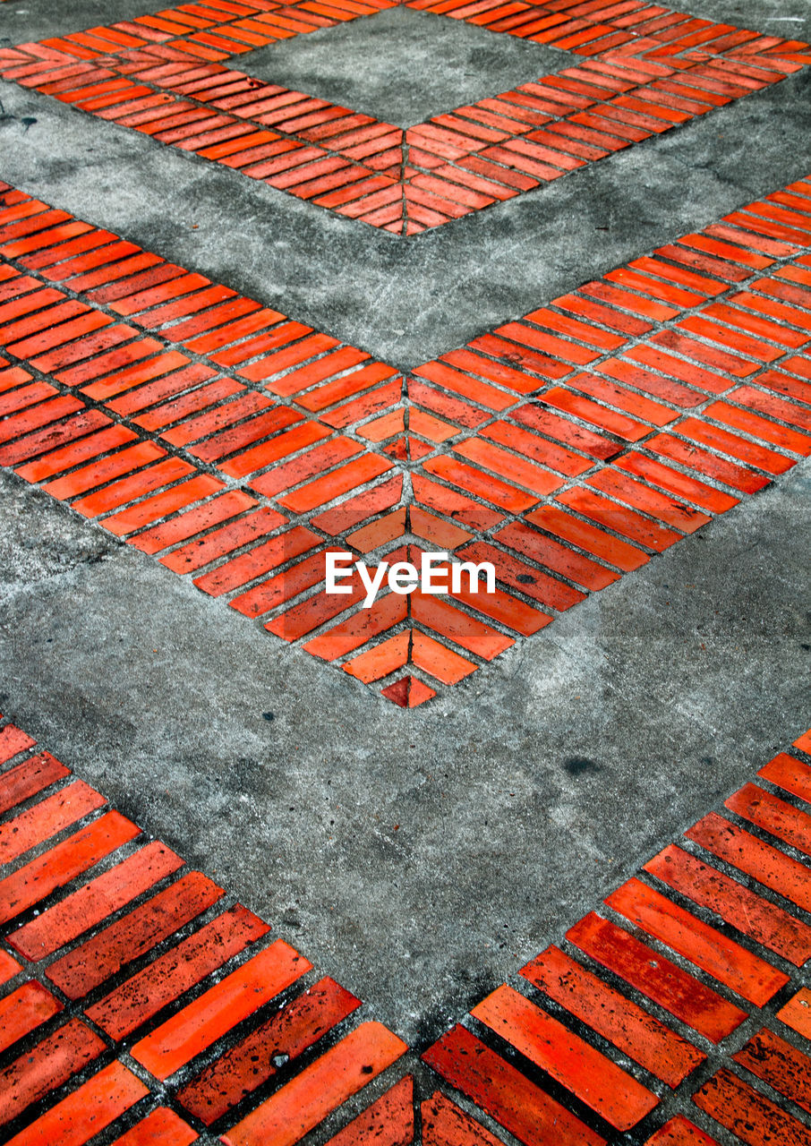 Full frame shot of red brick abstract pattern in the street