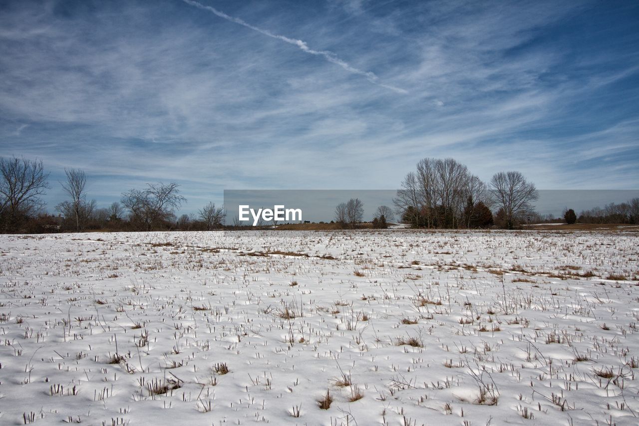 Scenic view of snow covered landscape against sky